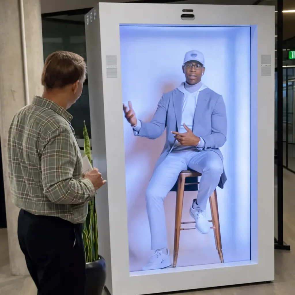 HoloBox holographic display projecting a 3D hologram above the unit creating a floating product demonstration at a B2B exhibition